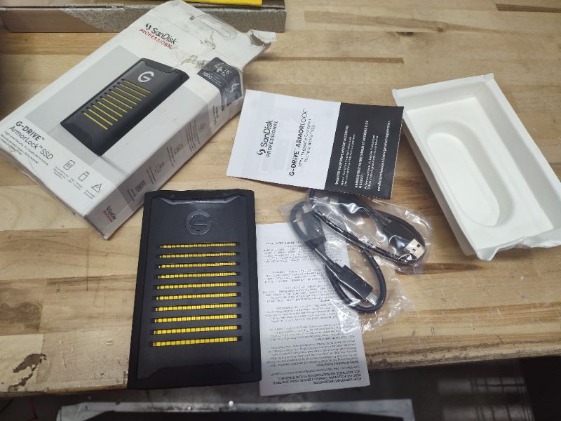 Photo 2 of **NONREFUNDABLE**FOR PARTS OR REPAIR**SEE NOTES**
SanDisk Professional 4TB G-Drive ArmorLock SSD - Encrypted NVMe Solid State Drive, 1000MB/s, USB-C, High-Level Security, Ultra Rugged - SDPS41A-004T-GBANB