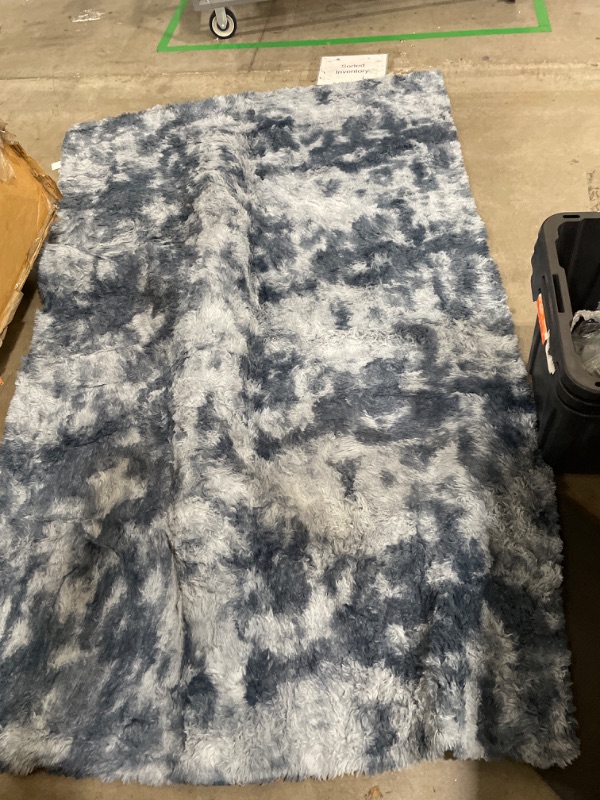 Photo 1 of 5'x8' blue area rug 
