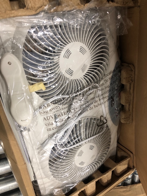 Photo 2 of ***USED - ONLY 1 SIDE WORKS - UNABLE TO TROUBLESHOOT***
Bionaire 8.5" Twin Window Fan with Reversible Airflow, 3 Speeds, Remote Control White 2 Blades Electronic control with LCD screen Window Fan