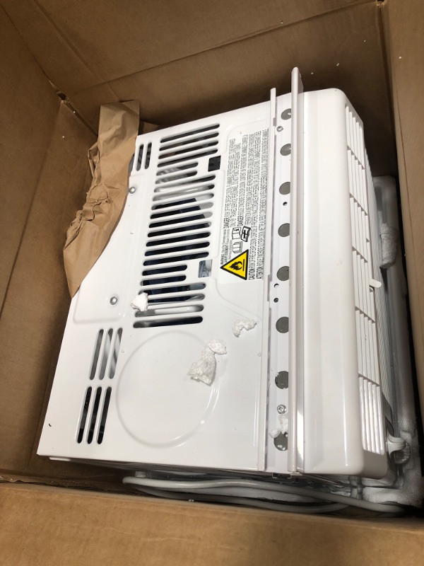 Photo 1 of Amazon Basics Window-Mounted Air Conditioner with Mechanical Control - Cools 150 Square Feet, 5000 BTU, AC Unit