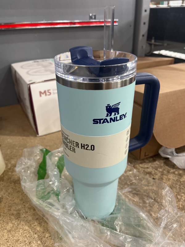 Photo 1 of ***USED - CHUNK OF GLUE STUCK TO SIDE***
Stanley Quencher H2.0 FlowState Stainless Steel Vacuum Insulated Tumbler with Lid and Straw for Water, Iced Tea or Coffee 40 oz Blue