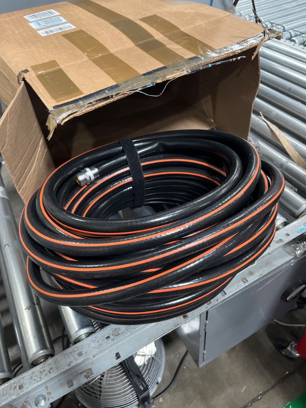 Photo 1 of black and orange garden hose