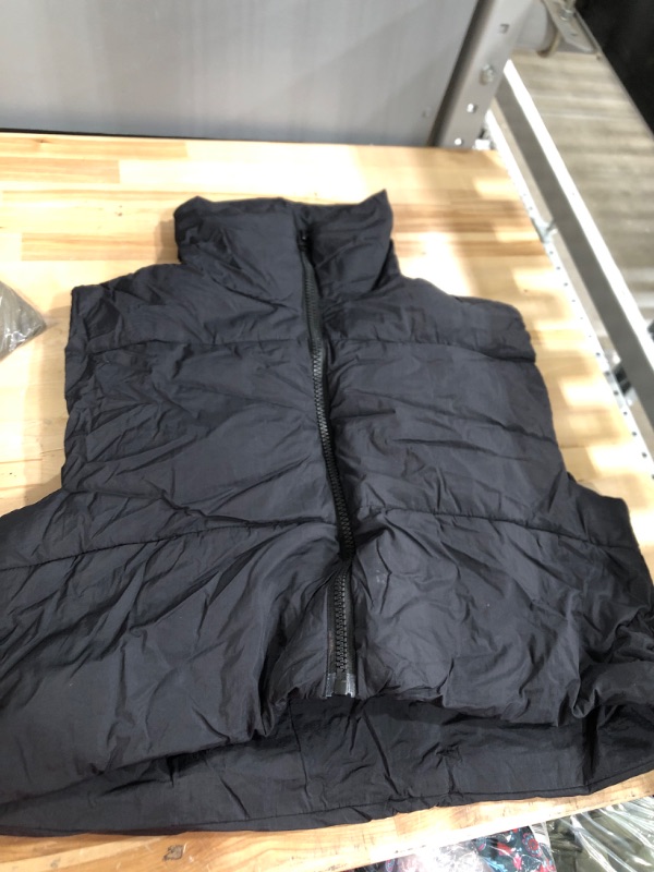 Photo 1 of Black puffer vest size xlarge