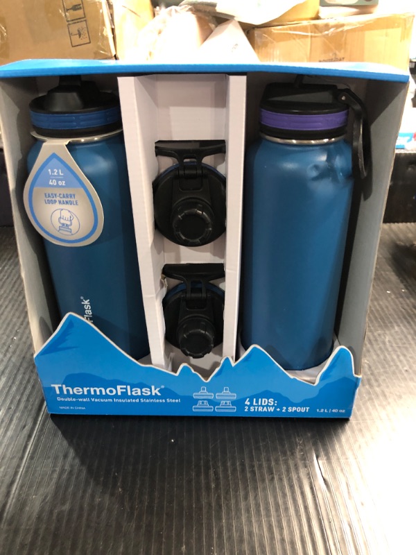 Photo 2 of **DENTED**ThermoFlask 40 oz Double Wall Vacuum Insulated Stainless Steel 2-Pack of Water Bottles, Superior Blue/Mauve