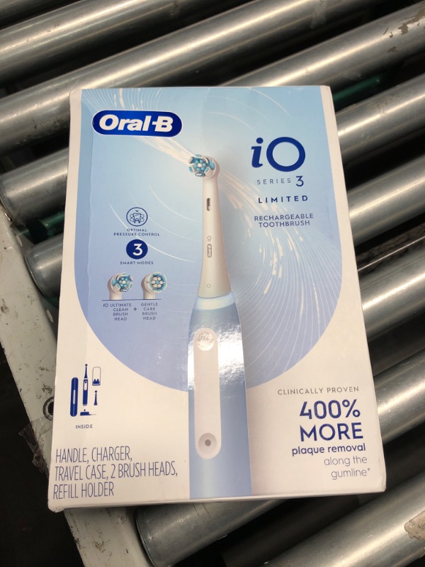 Photo 2 of ***FACTORY SEALED***Oral-B Power iO Series 3 Limited Electric Toothbrush, Icy Blue, iO3 Rechargeable Power Toothbrush with 2 Brush Heads, Travel Case and Refill Holder