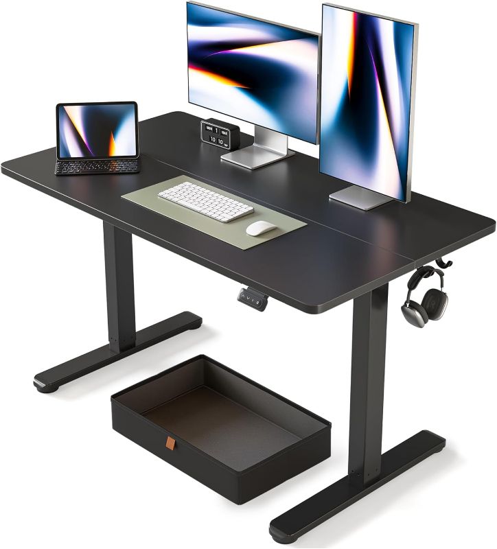 Photo 1 of (READ FULL POST) FEZIBO 55 x 24 Inches Standing Desk with Drawer, Adjustable Height Electric Stand up Desk with Storage, Sit Stand Home Office Desk, Ergonomic Computer Desk