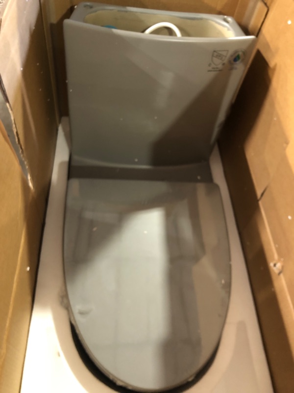 Photo 2 of **APPEARS UNUSED**
Reno 1-Piece 1.1/1.6 GPF Siphon Dual Flush Elongated ADA Chair Height Toilet in Glacier Gray, Seat Included