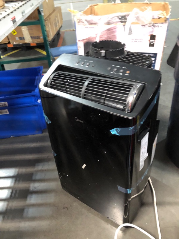 Photo 8 of ***NONREFUNDABLE - THIS SALE FINAL -  PARTS ONLY - SEE COMMENTS***
Midea Duo 14,000 BTU (12,000 BTU SACC) High Efficiency Inverter, Ultra Quiet Portable Air Conditioner, Cools up to 550 Sq. Ft., Works with Alexa/Google Assistant, Includes Remote Control &