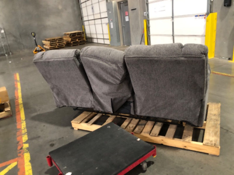 Photo 5 of ***TRUCK/TRAILER PICKUP ONLY - MAJOR DAMAGE - NO PACKAGING - SEE COMMENTS***
Signature Design by Ashley Tulen Modern Manual Pull Tab Reclining Sofa, Dark Gray Size: 87"W x 40"D x 40"H
