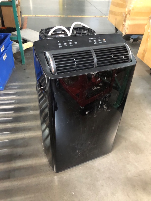 Photo 3 of ***USED - UNTESTED - SEE COMMENTS***
Midea Duo 12,000 BTU (10,000 BTU SACC) High Efficiency Inverter, Ultra Quiet Portable Air Conditioner, Cools up to 450 Sq. Ft., Works with Alexa/Google Assistant, Includes Remote Black 12,000 BTU