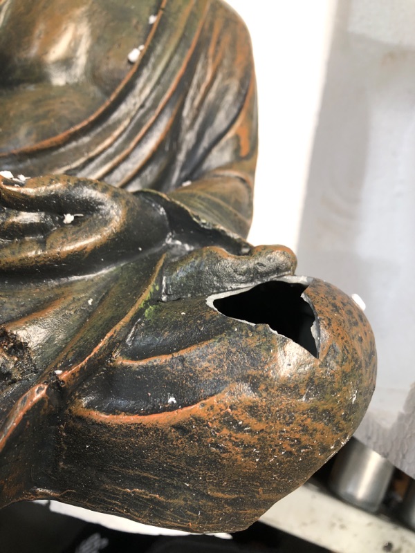 Photo 3 of **MAJOR DAMAGE HOLE IN KNEE STILL FUNCTIONAL**
Alpine Corporation GEM170 Buddha Statue, 10"L x 8"W x 15"H, Bronze Garden