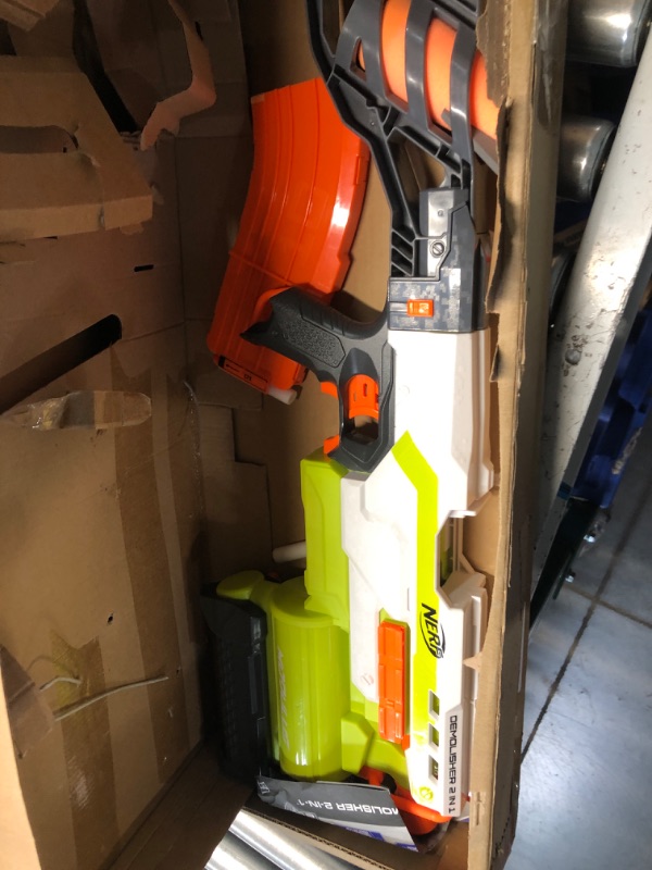 Photo 2 of **missing accessories**
NERF Modulus Demolisher 2-in-1 Motorized Blaster, Fires Darts and Rockets, Includes 10 Elite Darts, Banana Clip, 2 Rockets, Stock (Amazon Exclusive)