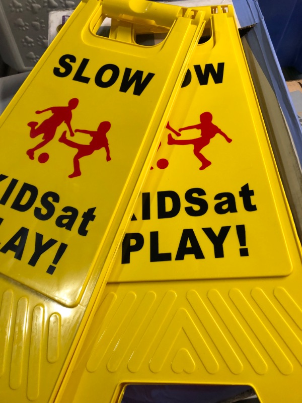 Photo 3 of Slow Kids at Play Signs, Children at Play Safety Signs 2 Pack, Text and Graphics Easier to Identify, Yellow Double Sided Signs for Schools, Street, Neighborhoods, Park, Day Cares, Sidewalk, Driveway