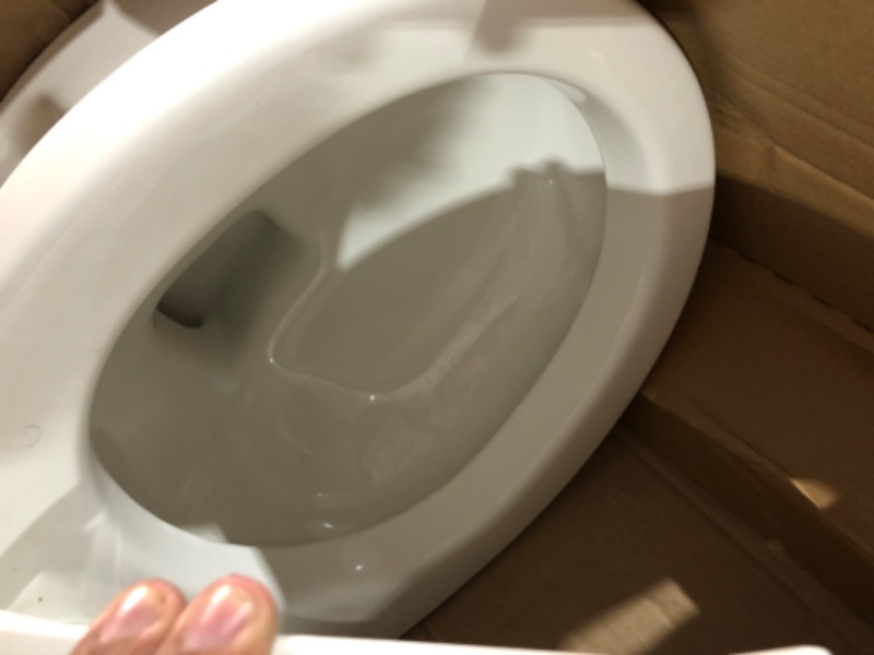 Photo 4 of (PREVIOUSLY INSTALLED SLIGHTLY USED) Reliant 2-Piece 1.28 GPF Single Flush Round Toilet with Slow Close Seat in White