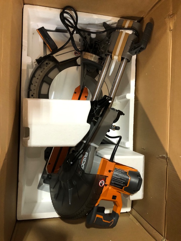 Photo 3 of ***USED - LIKELY MISSING PARTS - UNABLE TO VERIFY FUNCITONALITY***
RIDGID 15 Amp Corded 12 in. Dual Bevel Sliding Miter Saw with 70 Deg. Miter Capacity and LED Cut Line Indicator