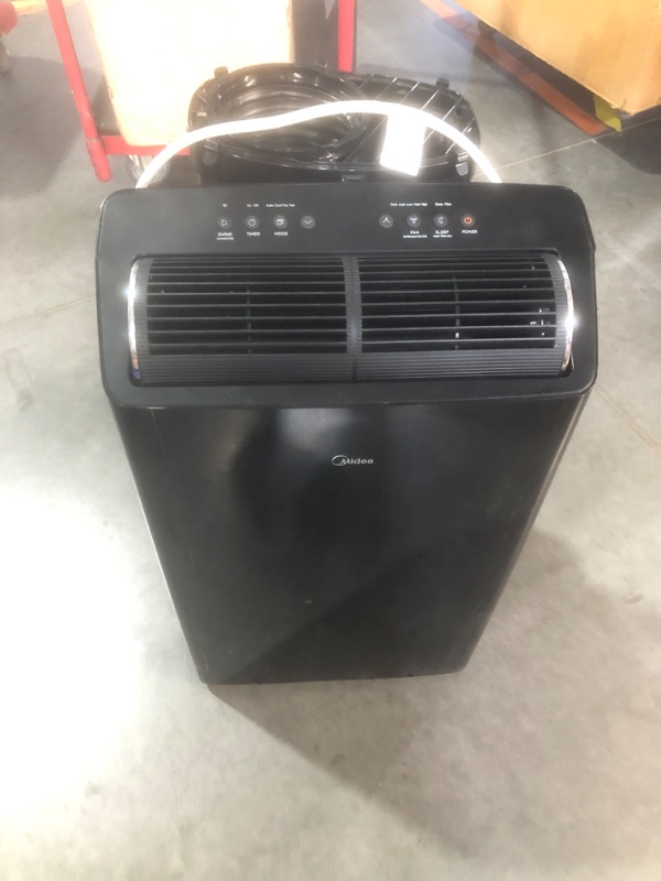 Photo 2 of ***USED - NO PACKAGING - MISSING ACCESSORIES, INCLUDING REMOTE - SEE PICTURES***
Midea Duo 14,000 BTU (12,000 BTU SACC) High Efficiency Inverter, Ultra Quiet Portable Air Conditioner, Cools up to 550 Sq. Ft., Works with Alexa/Google Assistant, Includes Re