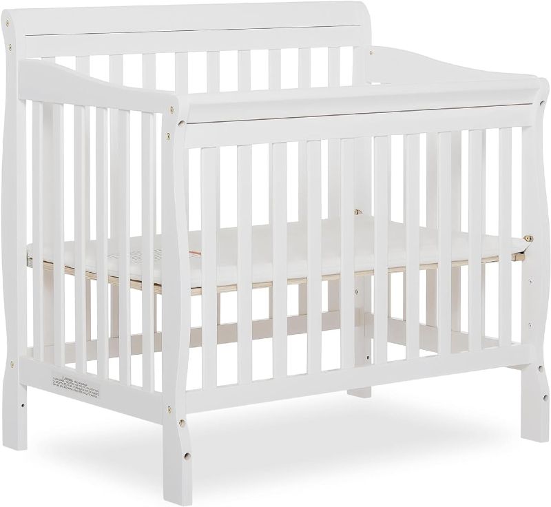 Photo 1 of ***DAMAGED - CRACKED - SEE PICTURES - UNABLE TO VERIFY FUNCTIONALITY***
Aden 4-in-1 Convertible Mini Crib In White, Greenguard Gold Certified, Non-Toxic Finish, New Zealand Pinewood, With 3 Mattress Height Settings