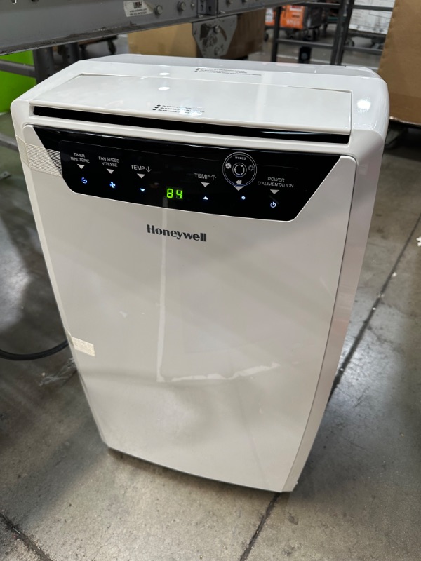 Photo 3 of **NON-REFUNDABLE, PARTS ONLY** Honeywell 14,000 BTU Portable Air Conditioner for Bedroom, Living Room, Apartment, 115V, Cools Rooms Up to 700 Sq. Ft. with Dehumidifier & Fan, Continuous Drain Option, 24-hour Timer, Remote, White White Up to 500 Sq. Ft. Co