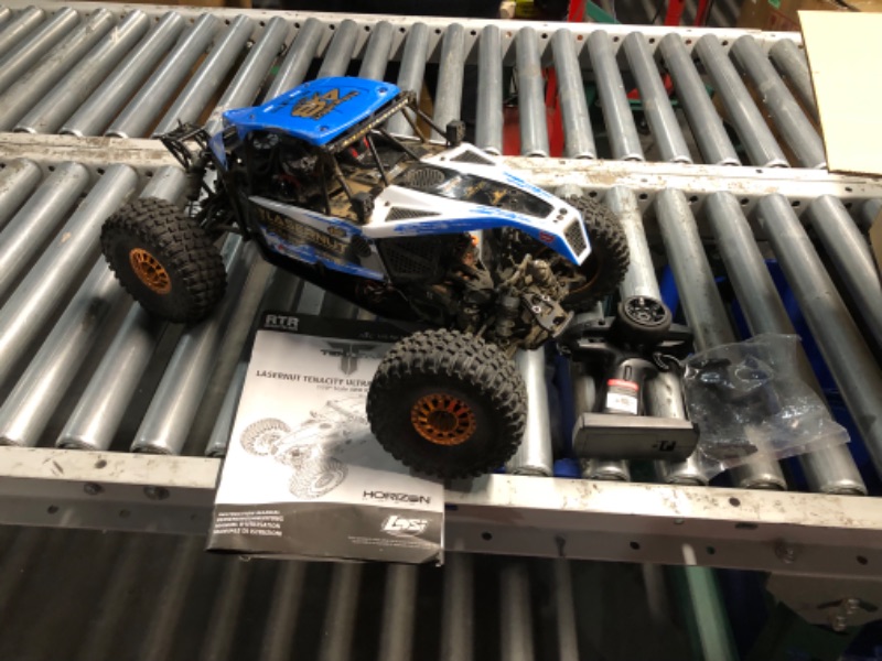 Photo 8 of ***USED - DAMAGED - MISSING PARTS - SEE COMMENTS***
Losi 1/10 Lasernut U4 4 Wheel Drive Brushless RTR Battery and Charger not included with Smart ESC Blue LOS03028T1