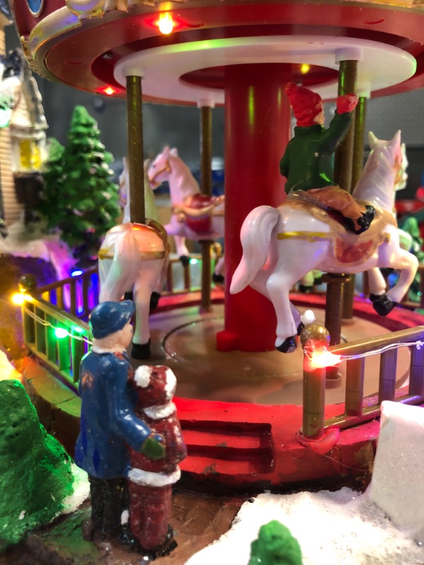 Photo 2 of (READ FULL POST) Alpine Corporation Animated Musical Christmas Theme Park Decor with 37 Multicolor LED Lights, 8 Holiday Songs, Moving Rides, and 5.6' Cord, 19" L x 12" W x 12" H
