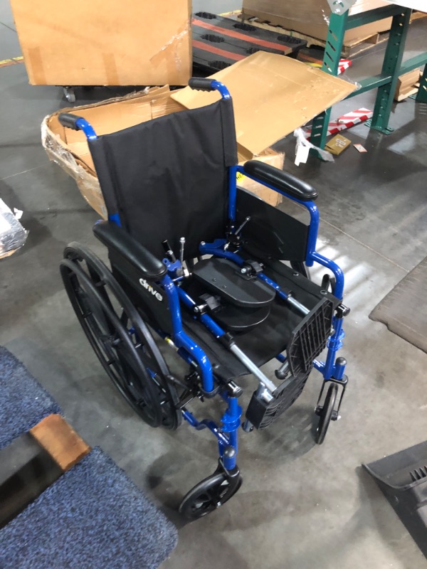 Photo 7 of (Broken wheel) 
Drive Medical Blue Streak Wheelchair with Flip Back Desk Arms, Elevating Leg Rests, 16 Inch Seat