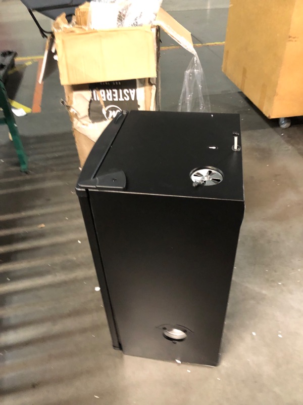 Photo 10 of ***DAMAGED - DENTED - NO PACKAGING - LIKELY MISSING PARTS - UNABLE TO VERIFY FUNCTIONALITY - SEE PICTURES***
Masterbuilt® 30-inch Digital Electric Vertical BBQ Smoker with Side Wood Chip Loader, Chrome Racks and 710 Cooking Square Inches in Black, Model M