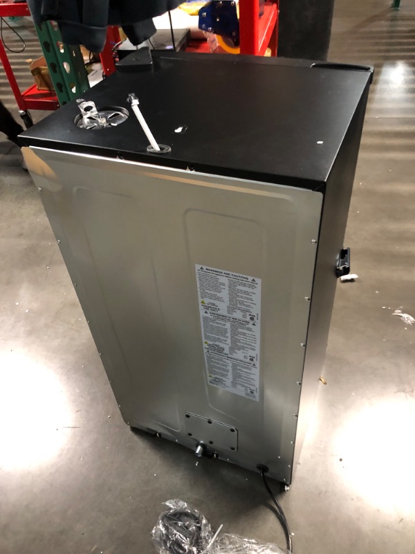 Photo 4 of ***DAMAGED - DENTED - NO PACKAGING - LIKELY MISSING PARTS - UNABLE TO VERIFY FUNCTIONALITY - SEE PICTURES***
Masterbuilt® 30-inch Digital Electric Vertical BBQ Smoker with Side Wood Chip Loader, Chrome Racks and 710 Cooking Square Inches in Black, Model M