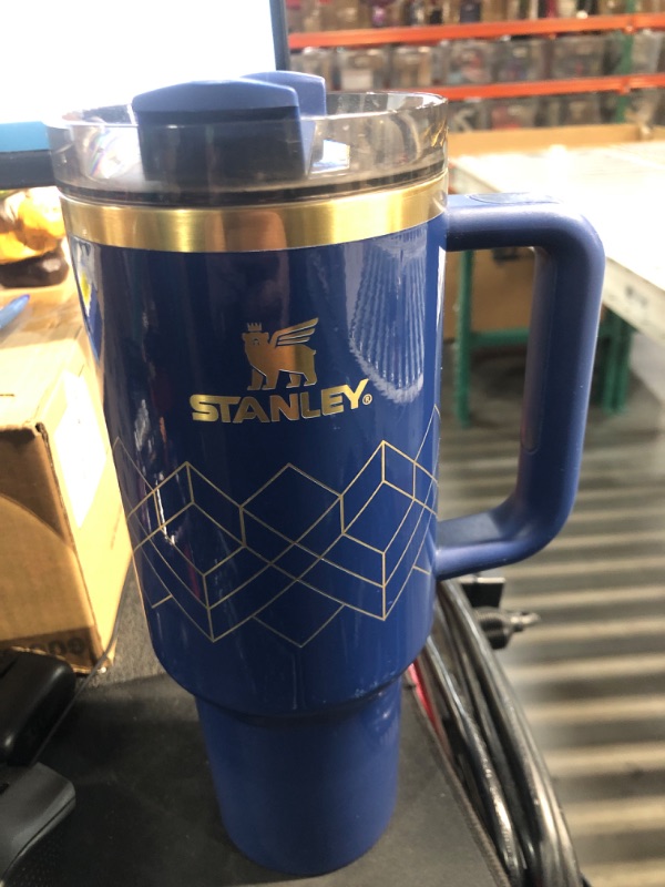 Photo 1 of ***(MINOR DAMAGE/ SEE NOTES) ***
Stanley Quencher H2.0 FlowState Stainless Steel Vacuum Insulated Tumbler with Lid and Straw for Water, Iced Tea or Coffee, Smoothie and More, BLUE WITH GOLD DESIGN, 40oz