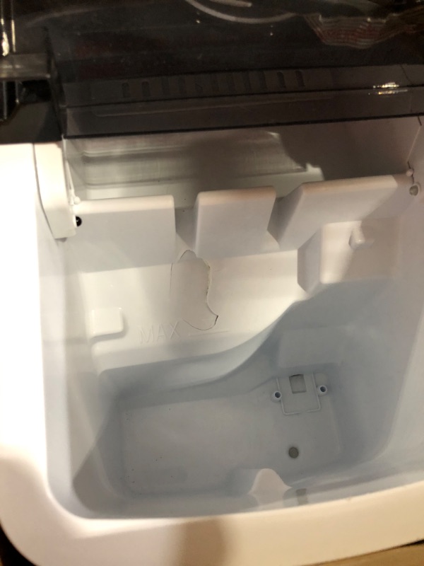 Photo 3 of ***USED - MAJOR DAMAGE - INTERIOR CRACKED - SEE PICTURES - UNABLE TO TEST***
Silonn Ice Maker Countertop, Portable Ice Machine with Carry Handle, Self-Cleaning Ice Makers with Basket and Scoop, 9 Cubes in 6 Mins, 26 lbs per Day, Ideal for Home, Kitchen, C