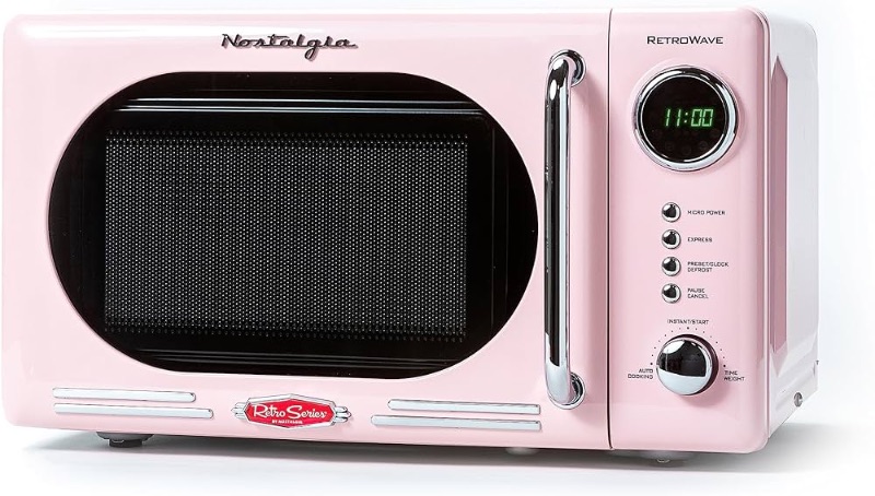 Photo 1 of *TURNS ON BUT DOESNT POWER ON UNIT* Nostalgia Retro Compact Countertop Microwave Oven - 0.7 Cu. Ft. - 700-Watts with LED Digital Display - Child Lock - Easy Clean Interior - Pink