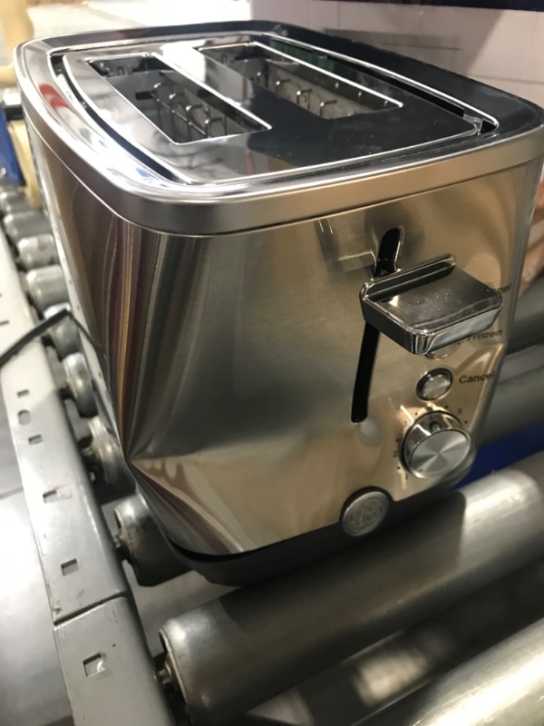 Photo 3 of ***PARTS ONLY******NON REFUNDABLE***
GE 2 Slice Stainless Steel Toaster, Extra Wide Slots for Toasting Bagels, Breads, Waffles & More, 7 Adjustable Shade Settings, Removable Crumb Tray, Countertop Kitchen Essentials, 850 Watts **DENT ON HANDLE SIDE / HAND