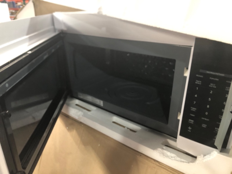 Photo 3 of 1.7 cu. ft. 1000-Watt Over the Range Microwave in White