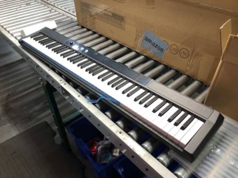 Photo 1 of ***USED - LIKELY MISSING PARTS - UNABLE TO VERIFY FUNCITONALITY***
UISCOM 88 Key Piano Keyboard Beginner Electric Digital Piano with Full Size Semi Weighted Keys,Sustain Pedal, Power Supply, Stand, Carrying Case,Headphones (Black)