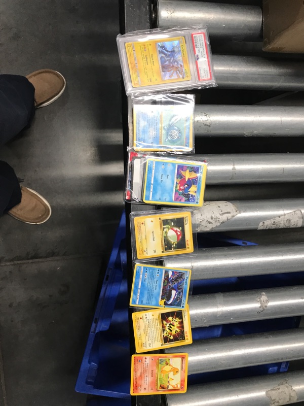 Photo 2 of ***NON REFUNDABLE***Pokemon TCG: Graded Card Mystery Power Pack - Gold Edition - 1 PSA 10 Graded Card + 25 Additional Cards with 5 Holofoils - 1 First Edition Card + 2 Factory Sealed 10 Card Booster Packs + 1 Code Card