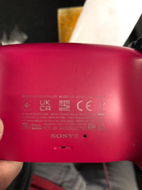 Photo 5 of (MINOR DAMAGE/ SEE NOTES) 
PlayStation DualSense® Wireless Controller - Cosmic Red **TURNS ON**