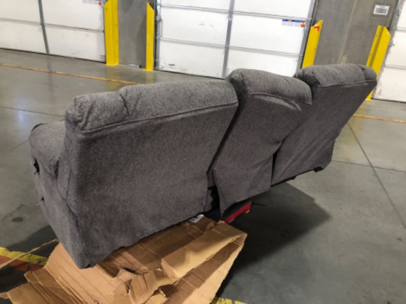 Photo 1 of ***TRUCK/TRAILER PICKUP ONLY - MAJOR DAMAGE - NO PACKAGING - SEE COMMENTS***
Signature Design by Ashley Tulen Modern Manual Pull Tab Reclining Sofa, Dark Gray Size: 87"W x 40"D x 40"H
