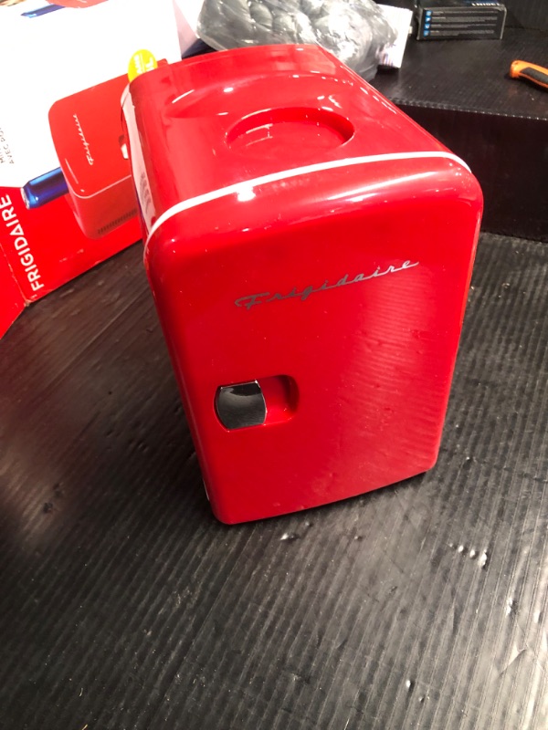 Photo 2 of ***NO POWER CORD***
Frigidaire RED EFMIS149_AMZ Mini Portable Compact Personal Fridge Cooler, 4 Liter Capacity Chills Six 12 oz Cans, 100% Freon-Free & Eco Friendly, Includes Plugs, standard