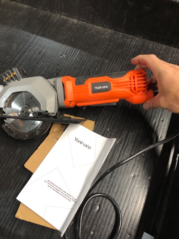 Photo 3 of **NON FUNCTIONAL** Yunirvana 4Amp 3500RPM Mini Circular Saw with Laser Guide, Vacuum Adapter, Blade Wrench and Rip Guide, Max. Cutting Depth1-5/8"(90°), 1-1/10"(45°?Compact Saw with 2 pcs 4-1/2" 24T TCT Blades