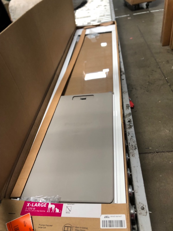 Photo 2 of ***USED - LIKELY MISSING PARTS - UNABLE TO VERIFY FUNCTIONALITY***
PetSafe 1-Piece Sliding Glass Pet Door for Dogs & Cats - Adjustable Height 75 7/8" to 80 11/16" X-Large, White, No-Cut Install, Aluminum Patio Panel Insert, Great for Renters or Seasonal I