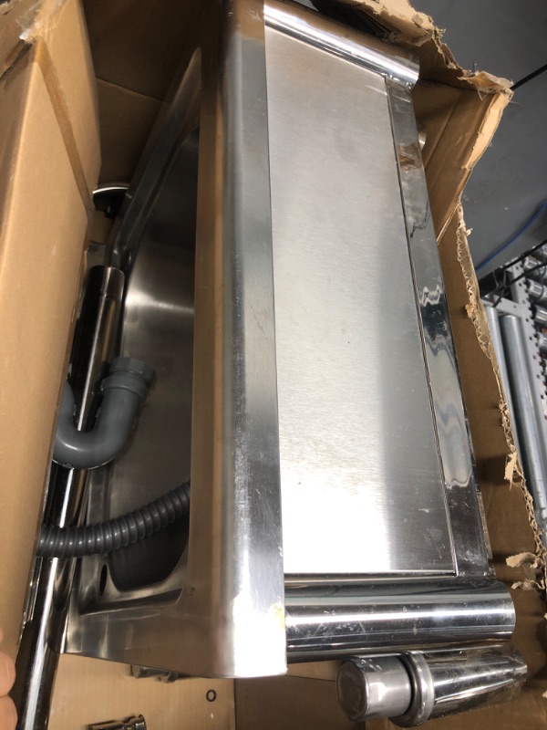 Photo 1 of 18"x21" stainless steel sink with drain
loose hardware