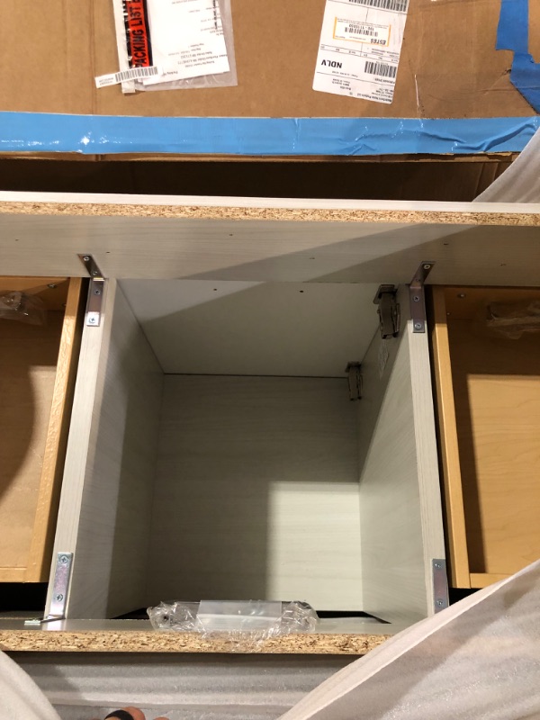 Photo 3 of ****TRUCK/TRAILER PICK UP REQUIRED. ITEM IS SOLD WITHOUT COUNTER TOP/ SINK AS WAS DAMAGED IN SHIPPING.***
Home Decorators Collection
Warford 48 in. W x 19 in. D x 33 in. H Single Sink Freestanding Bath Vanity in Elm Sky with White Cultured Marble Top