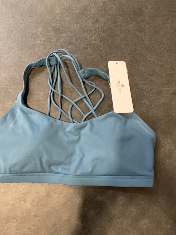 Photo 2 of size Medium RUNNING GIRL Strappy Sports Bra for Women Sexy Crisscross Back Light Support Yoga Bra with Removable Cups color (Teal)