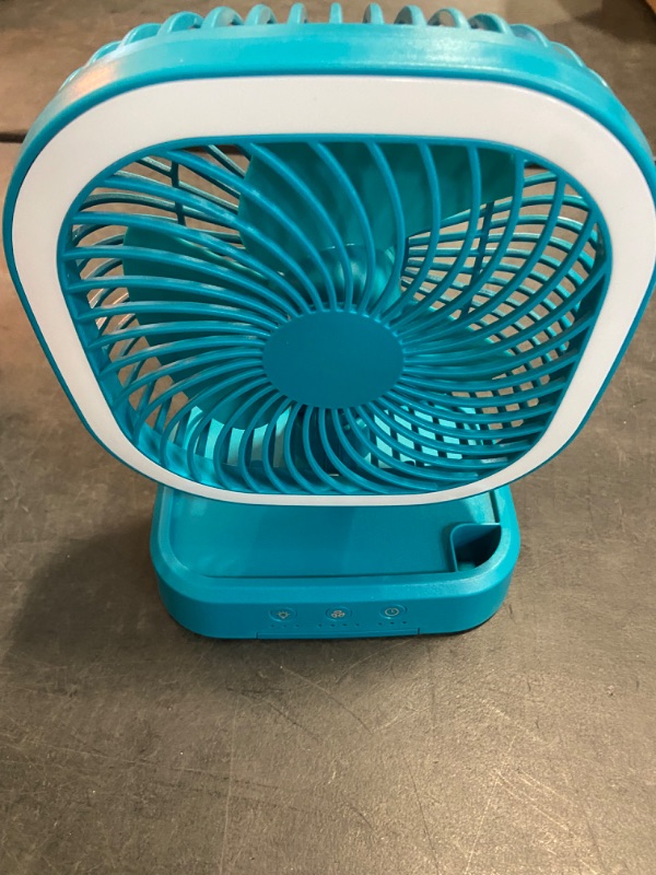 Photo 2 of Mainstays New Rechargeable Personal USB Fan with wireless charging pad and led lighting teal 