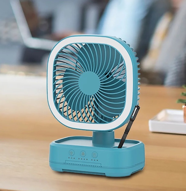 Photo 1 of Mainstays New Rechargeable Personal USB Fan with wireless charging pad and led lighting teal 