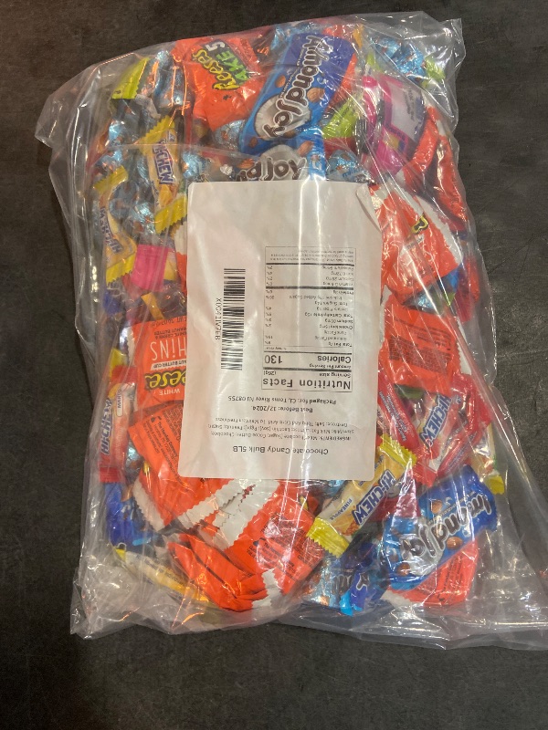 Photo 3 of Assorted candy bag full with heresy's kisses, Reese's thin white chocolate , paydays, twizzles wild berry, almond joys, hi chews, and jolly rancher hards and suckers. Expires 12/2024