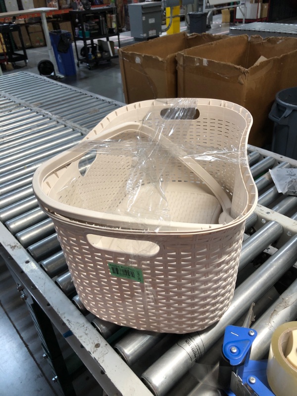 Photo 3 of **minor damge rim does not lock in still functional**
40 Liter Ivory Plastic Laundry Basket with Cutout Handles