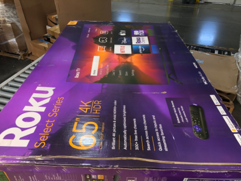 Photo 2 of **DAMAGE TO BOTTOM LEFT CORNER** Roku Smart TV – 65-Inch Select Series 4K HDR RokuTV Enhanced Voice Remote, Brilliant 4K Picture, Automatic Brightness, & Seamless Streaming – Live Local News, Sports, Family Entertainment 65"