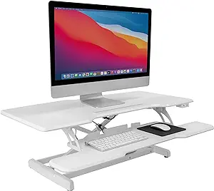 Photo 1 of Mount-It! Electric Standing Desk Converter with 38" Tabletop, Height Adjustable Sit Stand Desk Riser, Motorized Desk Riser with Keyboard Tray and Device Slot, Fits Monitor & Laptop, White Electric White