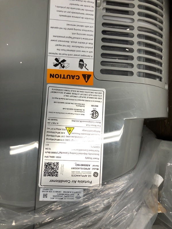 Photo 2 of ***USED - DAMAGED - SEE COMMENTS***
GE 10,500 BTU Portable Air Conditioner for Medium Rooms up to 450 sq ft., 3-in-1 with Dehumidify, Fan and Auto Evaporation, Dual Hose Compatible, Included Window Installation Kit, Grey