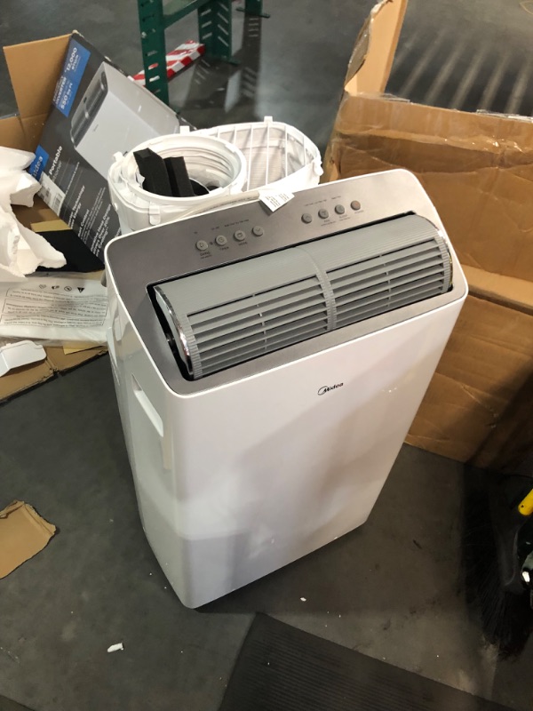 Photo 2 of **SEE NOTES**
Midea Duo 14,000 BTU (12,000 BTU SACC) High Efficiency Inverter Quiet Portable Air Conditioner,with Heat up to 550 Sq. Ft.,white, Works with Alexa/Google Assistant, with Remote Control & Window Kit